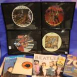 Selection of framed CDs, two Odeon orange singles and Beatles books/magazines. Not available for