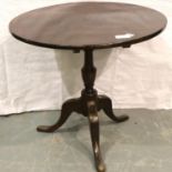 19th century mahogany circular tripod table with tilting top, H: 80 cm. Not available for in-house