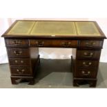 Mahogany eight drawer desk with leather inset top, 122 x 63 cm. Not available for in-house P&P,