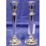 Pair of hallmarked silver candlesticks, H: 17 cm, Birmingham assay. Both damaged and filled.