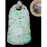 Hand carved jade pendant, H: 55 mm. Some dust gathered in the holes and some surface scratches/