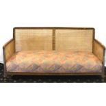 Upholstered Bergere settee with complete canework, L: 168 cm. Not available for in-house P&P,