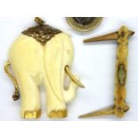 Antique bone elephant pendant and a bone or ivory pen knife style toothpick. P&P Group 1 (£14+VAT