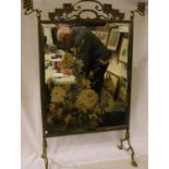 Large brass framed, Art Nouveau fire screen with painted mirror panel, overall 83 x 60 cm. Not