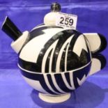 Lorna Bailey limited edition cup and teapot 6/50 in the Monochrome pattern. Teapot H: 20 cm. No