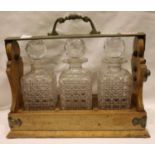 Vintage Betjemanns of London three bottle tantalus (no key), with hobnail cut decanters and