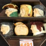 Six Doulton small character jugs on a wooden shelf, H: 25 cm. P&P Group 2 (£18+VAT for the first lot