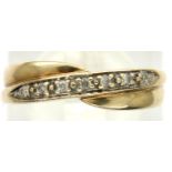9ct gold diamond set crossover ring, size L, 2.1g. P&P Group 1 (£14+VAT for the first lot and £1+VAT