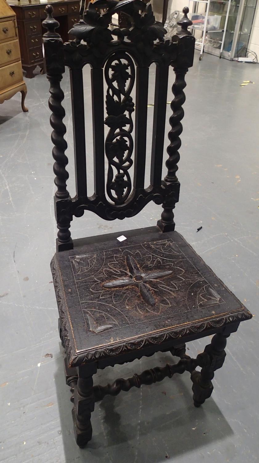An early oak hall chair with carved decoration. Not available for in-house P&P, contact Paul O'Hea