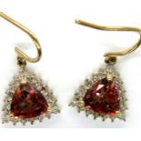 9ct gold topaz and diamond set earrings, combined 3.0g. P&P Group 1 (£14+VAT for the first lot