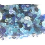 Mixed loose gemstones including sapphires, topaz, aquamarine and others, over 50cts in total. P&P