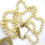 Early 20th century French single strand of graduated pearls with an 18ct gold clasp and 9ct gold