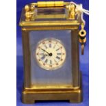Miniature brass carriage clock with painted enamel dial, H: 50 mm. Working at lotting. P&P Group