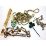 Collection of vintage costume jewellery, including an enamelled egg pendant, tie clip, neck chains