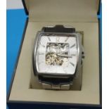 Kenneth Cole; gents skeleton wristwatch on stainless steel bracelet, boxed, working at lotting, lens