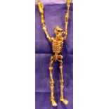 Butler and Wilson skeleton necklace. P&P Group 1 (£14+VAT for the first lot and £1+VAT for