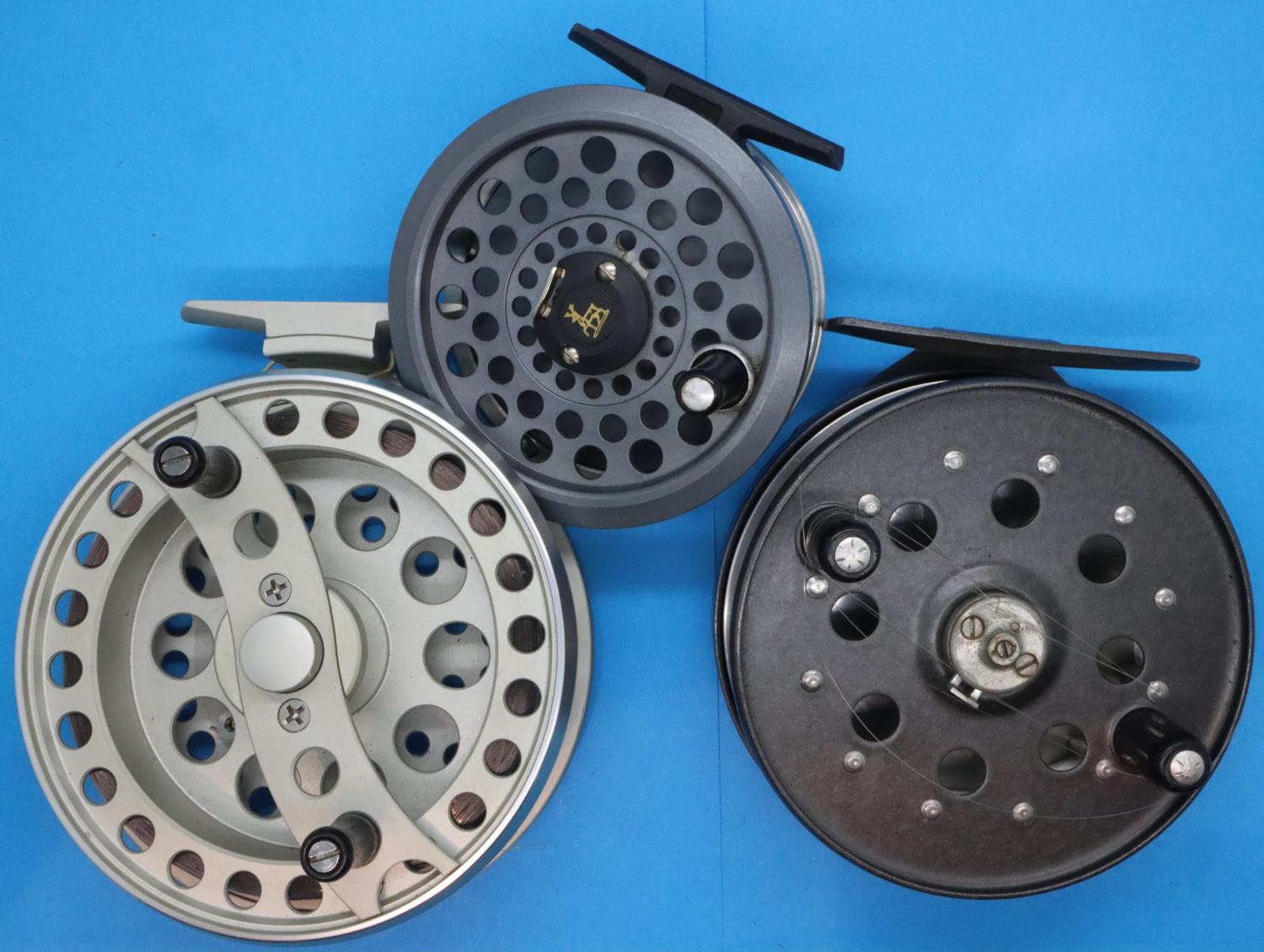 Three fly fishing reels including Okuma aventa, Shakespeare model 2626 and striker right ultraflo.