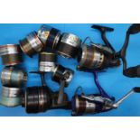 Three Daiwa fishing reels and eight spare spools. P&P Group 2 (£18+VAT for the first lot and £3+