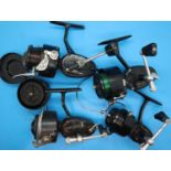 Four Mitchell fishing reels models 300, 308,330 and a 440A and spare reel. P&P Group 2 (£18+VAT