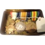 WWI Princess Mary Christmas tin containing a British medal trio awarded to PTE J Friend 15145 of the