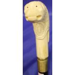 Carved bone handled, animal head walking stick, L: 90 cm. P&P Group 2 (£18+VAT for the first lot and