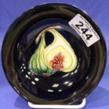 Moorcroft footed bowl, Blue ground in the Queens choice pattern, Impressed and painted marks to
