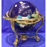 Large globe set with semi precious stones, on brass stand with compass, D: 40 cm. Not available
