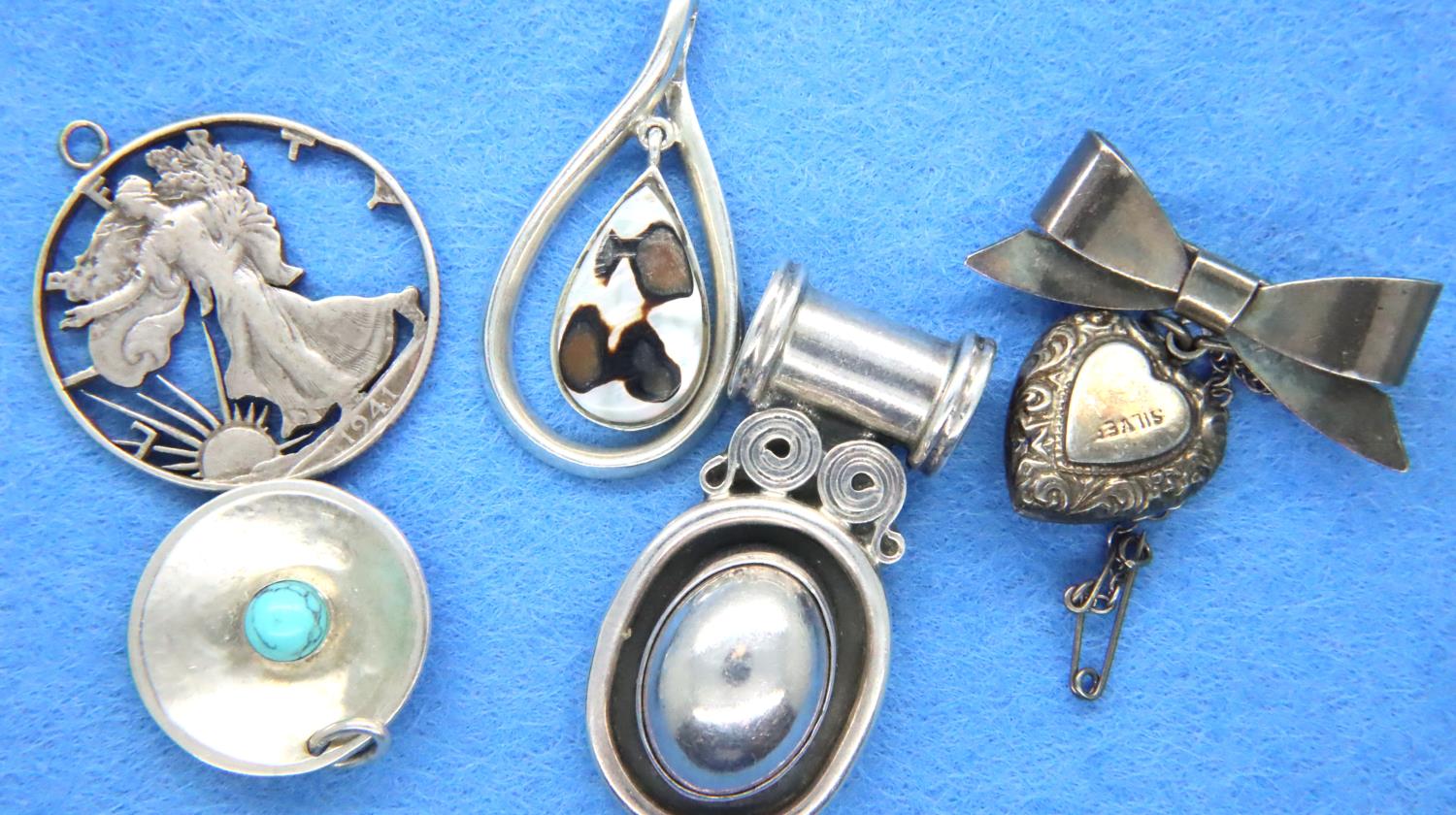 Five 925 silver pendants, largest L: 40 mm, combined 50g. P&P Group 1 (£14+VAT for the first lot and