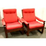 Guy Rogers pair of Virginia lounge chairs, one arm joint loose, mild surface marks, upholstery good.