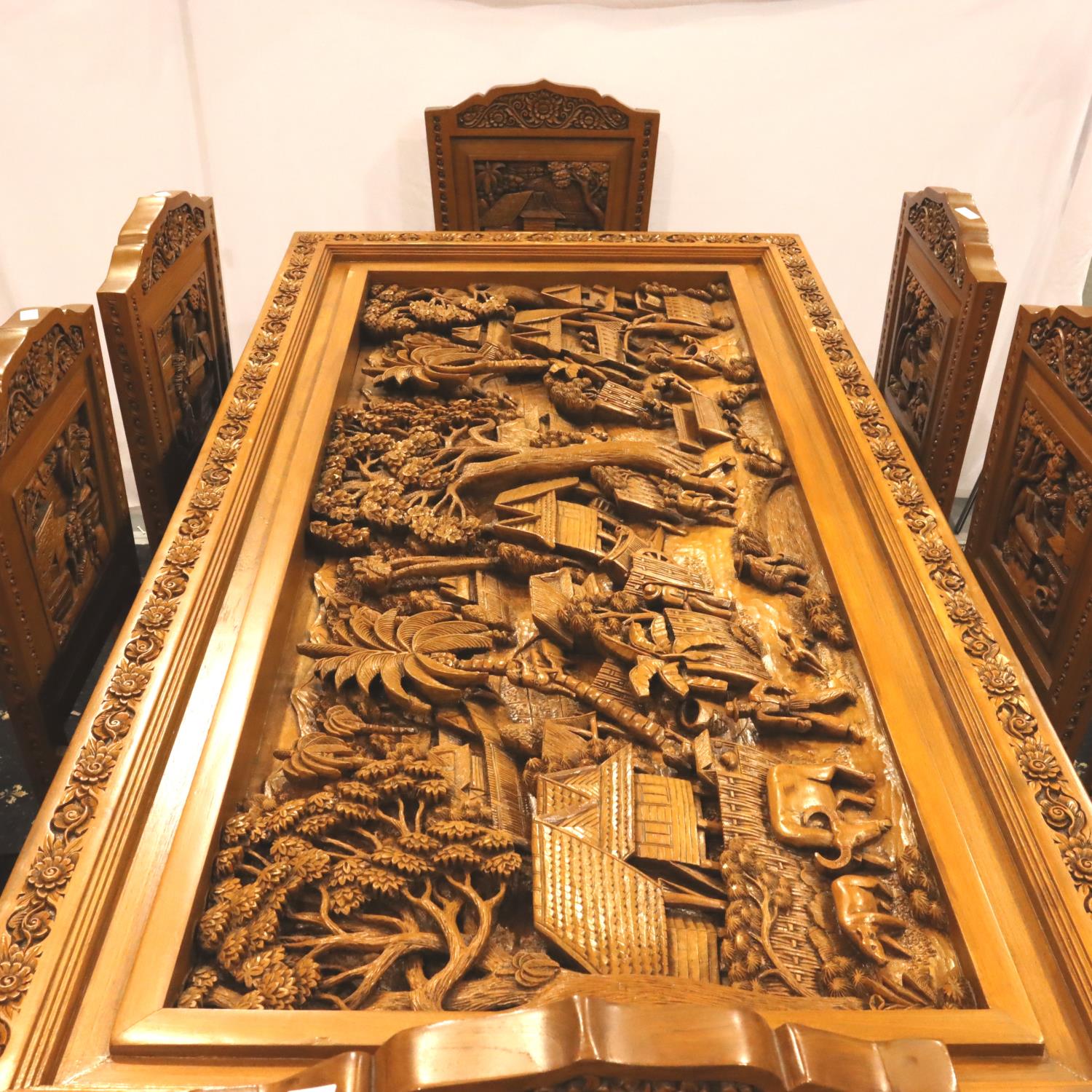 A deeply carved substantial Oriental hardwood dining table with plate glass top displaying figures - Image 12 of 14