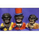 Three cast iron figural money boxes, one with top hat. P&P Group 3 (£25+VAT for the first lot and £