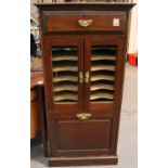 An Edwardian mahogany music cabinet of large proportions, with single drawer, twelve internal