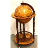 A reproduction drinks globe of small proportions H: 86 cm, some loss of paper too globe. Not