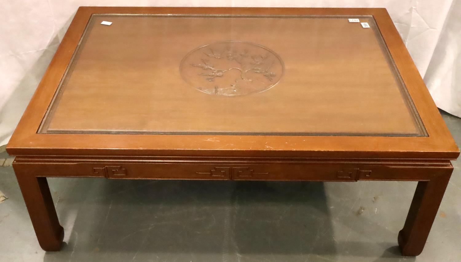 A large Oriental hardwood coffee table carved with inset glass top, 122 x 87 x 46 cm H. Not