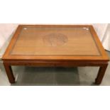 A large Oriental hardwood coffee table carved with inset glass top, 122 x 87 x 46 cm H. Not