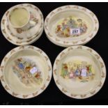 Royal Doulton Bunnykins; oval bowl, cup and saucer set, two serving bowls and six further bowls. Not
