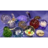 Twelve mixed glass paperweights including Caithness. Not available for in-house P&P, contact Paul