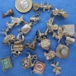 Collection of mixed silver charms (22), 77g. P&P Group 1 (£14+VAT for the first lot and £1+VAT for
