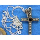 Garnet and marcasite cross on a silver chain. P&P Group 1 (£14+VAT for the first lot and £1+VAT
