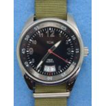 TCM; gents wristwatch on canvas strap, working at lotting. P&P Group 1 (£14+VAT for the first lot