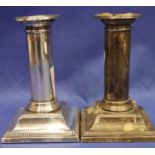 A pair of hallmarked silver weighted stub candlesticks by Elkington & Co. Sheffield assay, H: 13 cm.