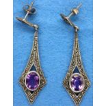 A pair of amethyst and marcasite silver earrings. P&P Group 1 (£14+VAT for the first lot and £1+