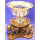 A heavy Victorian gilt and enamelled glass pedestal bowl (chipped) with a later carved wood elephant