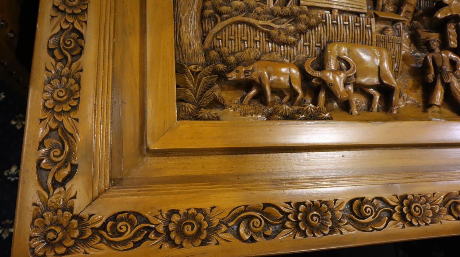 A deeply carved substantial Oriental hardwood dining table with plate glass top displaying figures - Image 10 of 14