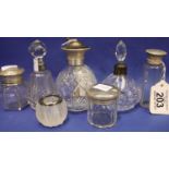 Cut glass silver topped atomiser, two scent bottles with silver collars, two glass jars with