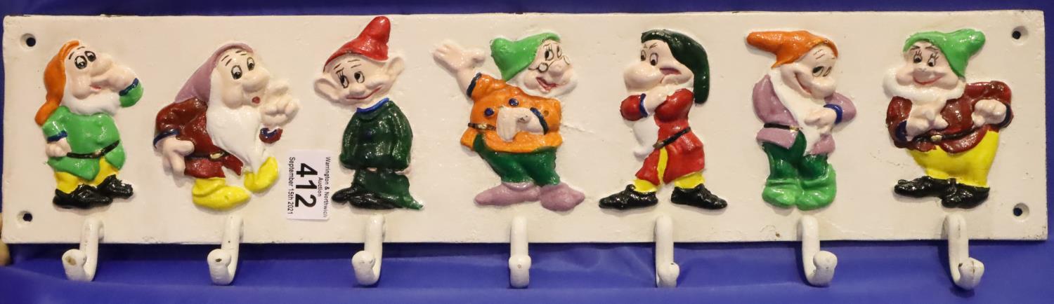 Cast iron Seven Dwarves coat rack, L: 65 cm. P&P Group 3 (£25+VAT for the first lot and £5+VAT for