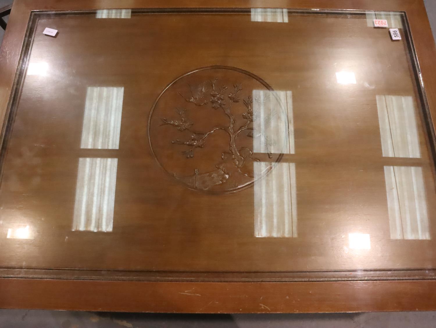 A large Oriental hardwood coffee table carved with inset glass top, 122 x 87 x 46 cm H. Not - Image 2 of 2
