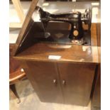 Vintage treadle Singer sewing machine with oak cabinet base. Not available for in-house P&P, contact