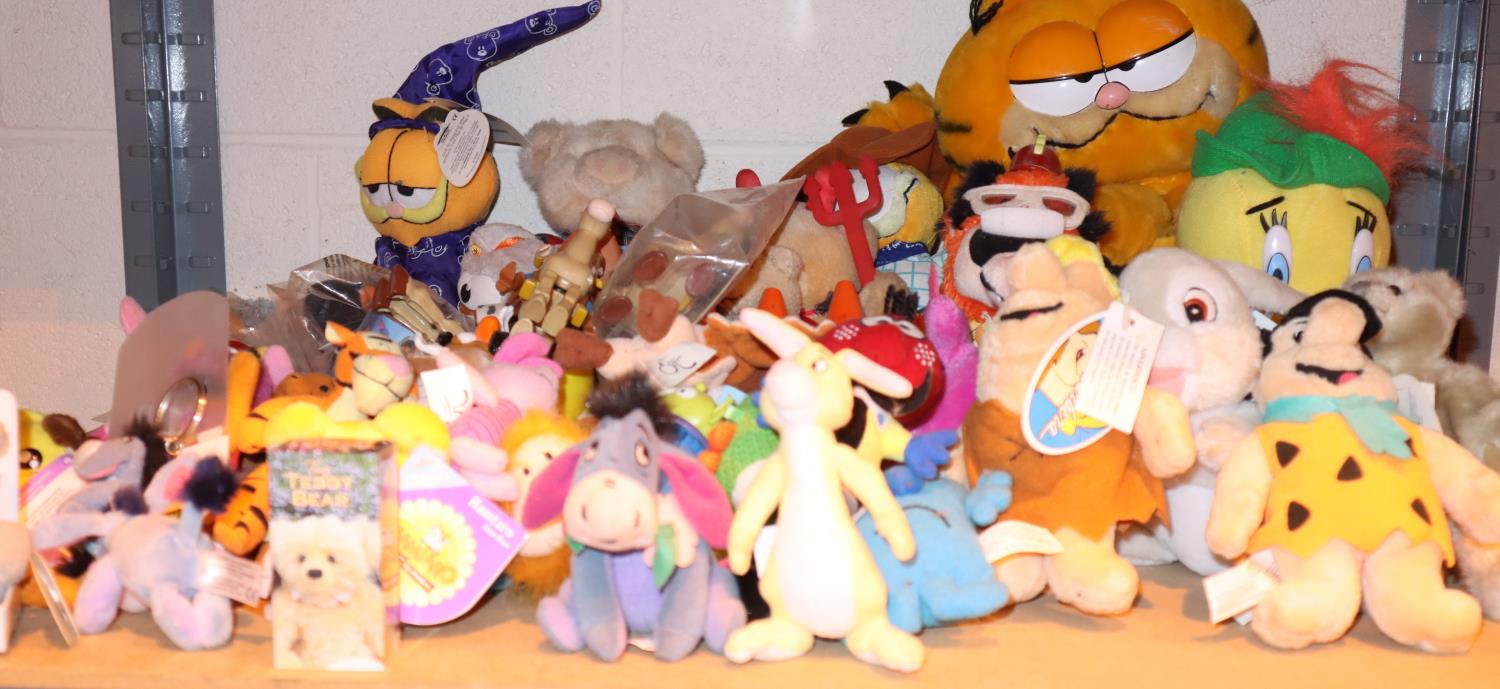 Shelf of mixed soft toys including Garfield, Flintstones etc. Not available for in-house P&P,