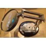 Opticians magnifying lens on adjustable metal stand 1350 (What A Son's LTD London 1814). Not